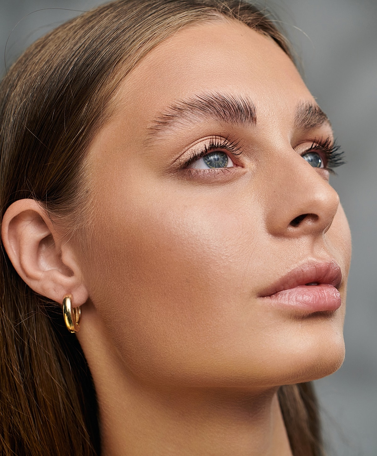 Close-up of model's face with natural makeup.