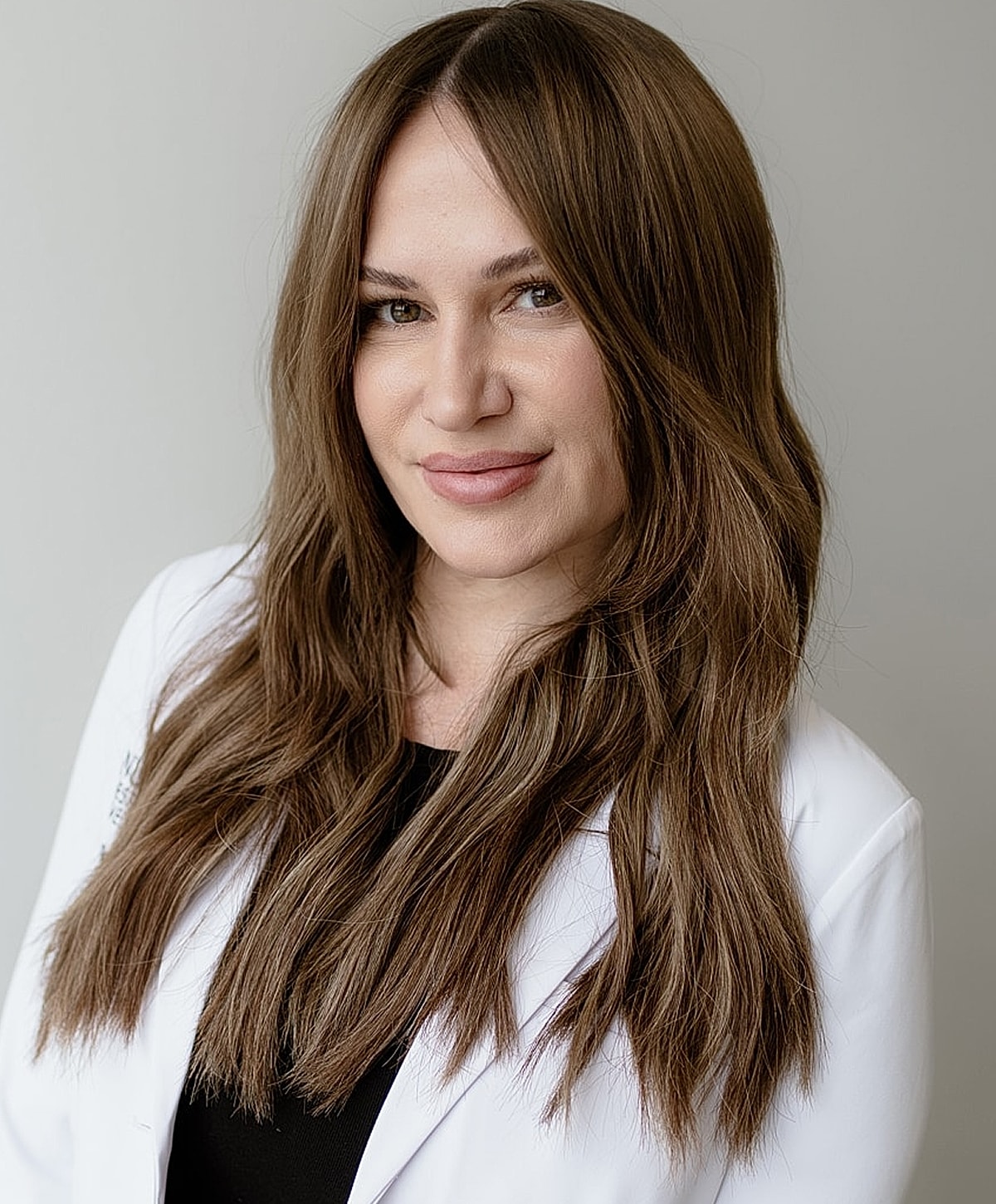 Professional woman in a medical white coat.