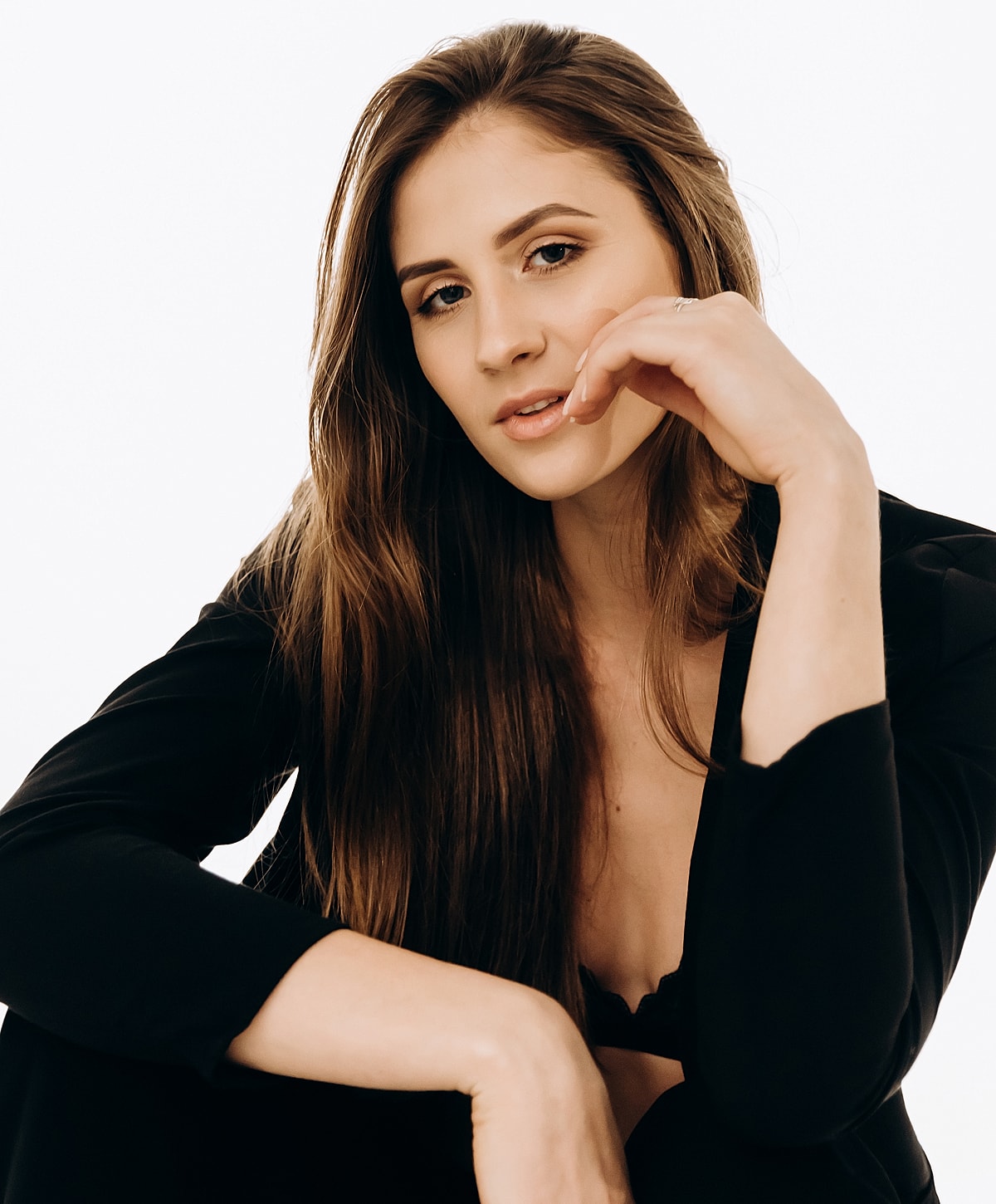 Model posing with a thoughtful expression.