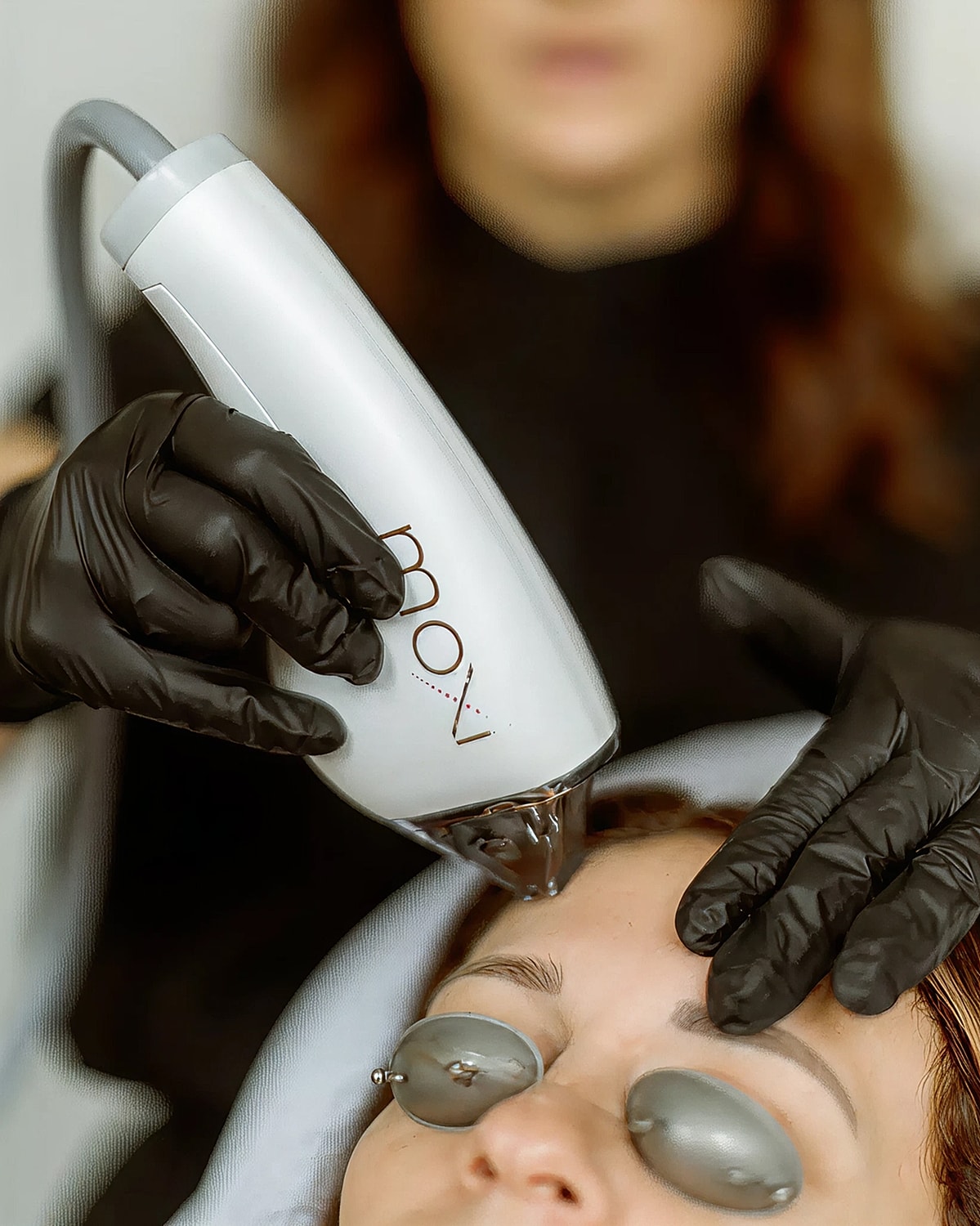 Facial treatment with specialized beauty device.
