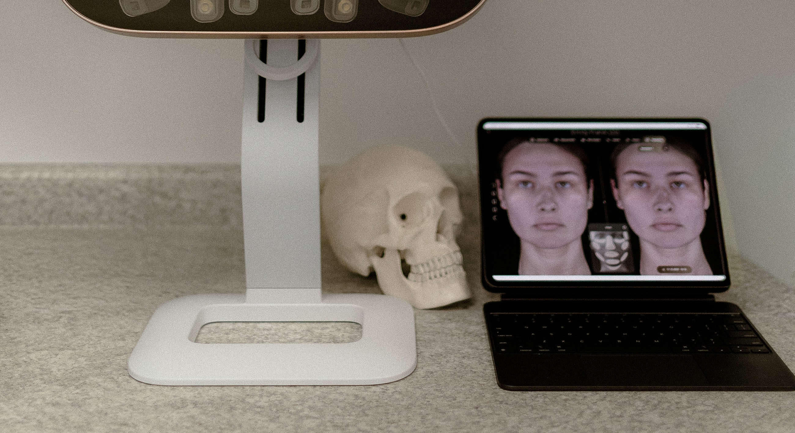 Medical technology setup with face analysis display.