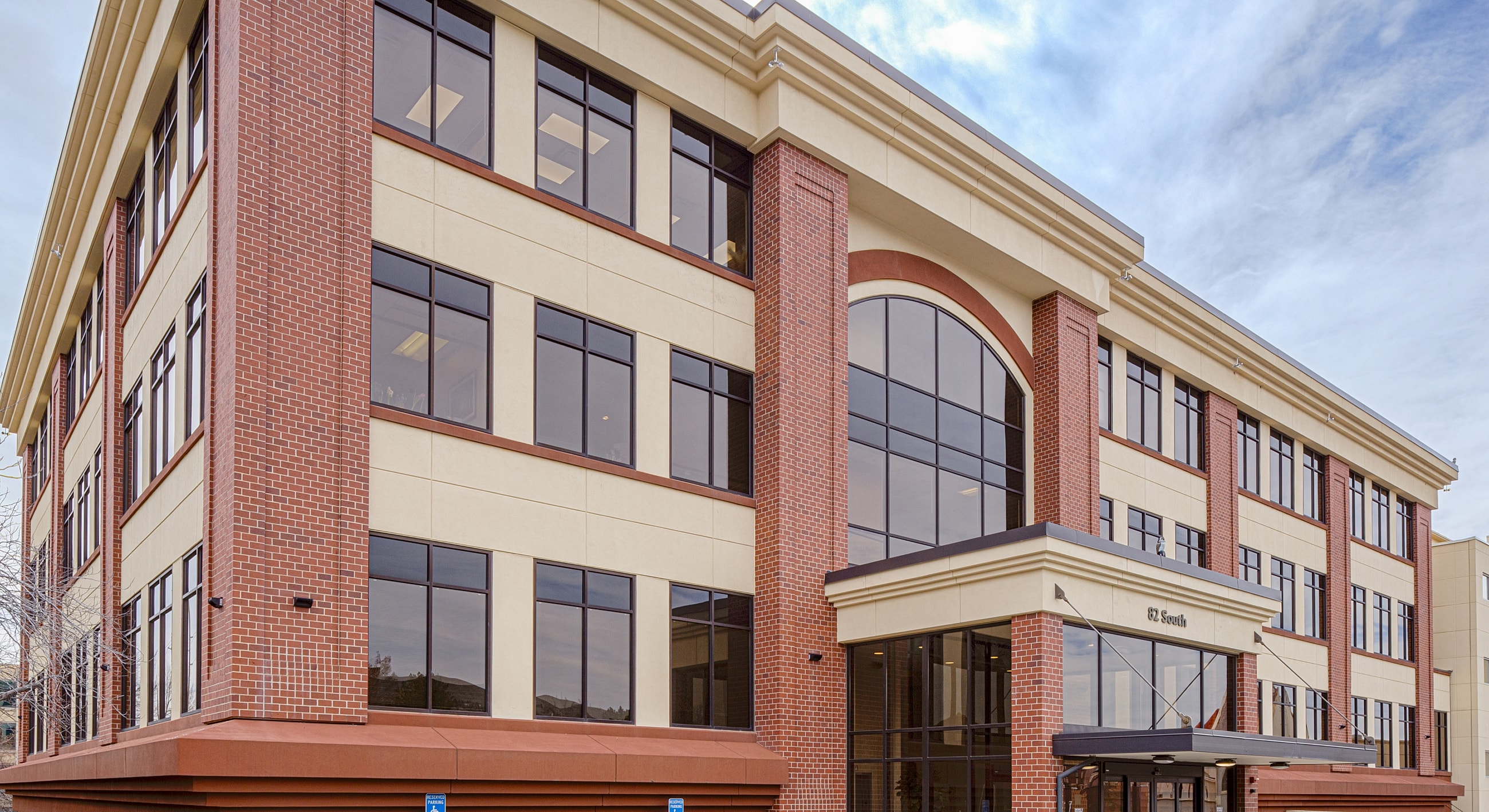 Modern multi-story brick office building exterior.