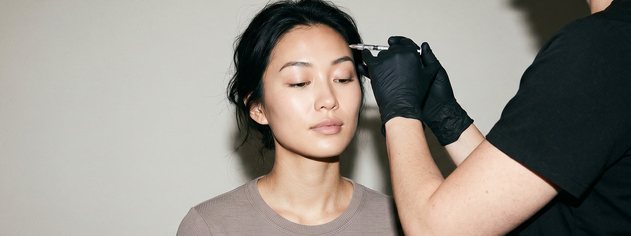 Woman receiving cosmetic treatment in a clinic.